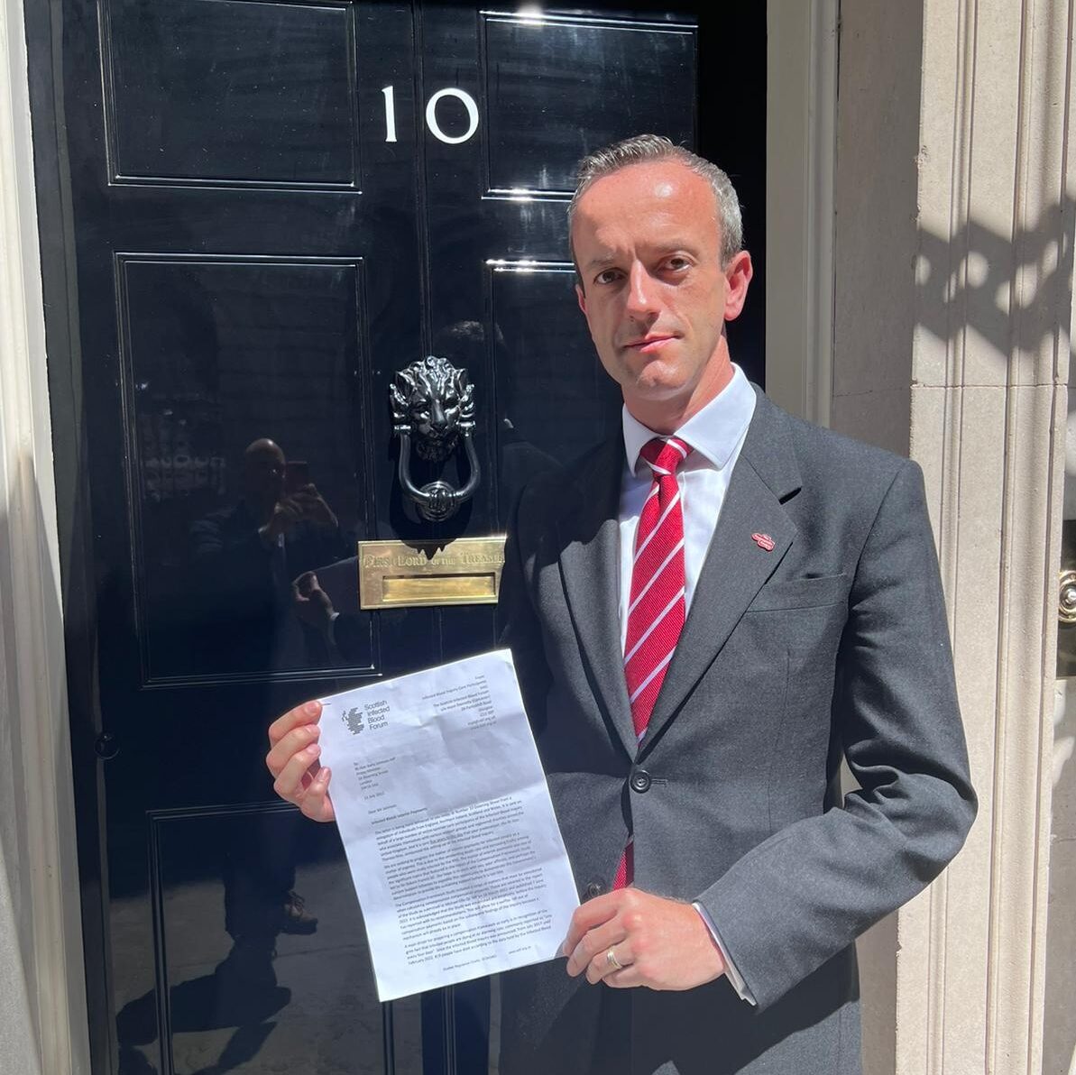 Clive Smith at 10 Downing Street calling for interim compensation